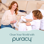 Smiling adult and child folding laundry on a couch with Puracy logo and slogan "Clean Your World with Puracy" at bottom.