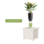 Graphic showing a potted plant being dropped into a white lattice planter with directional arrows