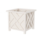 White outdoor lattice square planter box with crisscross paneling on a white background