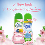 Promotional graphic showing old and new Purex Crystals Cherry Blossom bottles with floral accents and 'new look' text