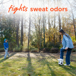 Outdoor scene of two children playing soccer in a sunlit yard with 'fights sweat odors' headline