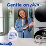 Lifestyle image of a woman smiling in a laundry room with a Purex Free & Clear bottle on the counter and 'Gentle on skin' headline