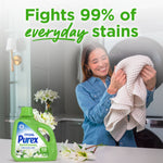 Smiling woman holding a towel in a laundry room with Purex Natural Elements bottle and text claiming it fights 99% of everyday stains