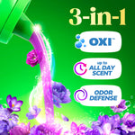 Pouring purple liquid and floral accents with 3-in-1 icons for OXI, all-day scent and odor defense