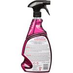 Translucent purple spray bottle with black trigger shown from the back, displaying warning and product information labels