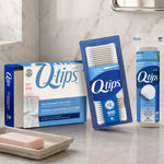 Bathroom countertop scene featuring Q-tips face towels box alongside Q-tips cotton swabs and cotton rounds packaging