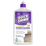 Close-up product shot of a Quick Shine hardwood floor cleaner bottle with purple cap and label showing wood floor images.