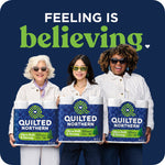 Three people holding Quilted Northern pack graphics beneath headline reading 'feeling is believing' on navy background