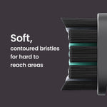 Close macro side view of contoured black bristles on a quip brush pod with explanatory text on dark background