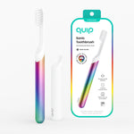 Rainbow-metal quip sonic toothbrush with white travel cover and product packaging shown on a white background