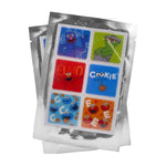 Three sealed silver foil sachets showing a sheet of colorful Sesame Street themed square repellent patches