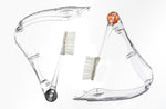 Three Radius Tour travel toothbrushes shown folded and unfolded in clear plastic with colored hinge accents on white