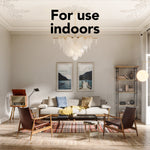Well-lit living room interior with large windows and overlay text 'For use indoors' centered at top of the image.