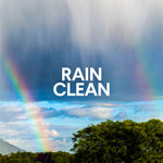Scenic image of a landscape with rain and a rainbow overlaid with the text 'RAIN CLEAN' to indicate the product scent.