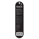 Back of Reach Essentials toothbrush packaging showing product description, usage claims, distributor info and a barcode on black card backing.