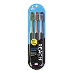 Three REACH toothbrushes in pastel handles packaged on blue blister card with brand logo and promotional sticker