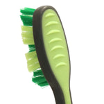 Side view of a toothbrush handle and head showing green rubber grip and dual-tone green bristles