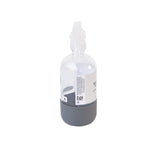 Rear angled view of labeled clear spray bottle with translucent trigger and gray rubber bottom