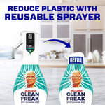 Two Clean Freak bottles pictured on a kitchen counter with text promoting reducing plastic by using a reusable sprayer and refill.