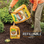 Person refilling a Preen Extended Control applicator jug from a larger refill pouch over mulch, caption reads 'REFILLABLE'.