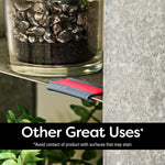 Red and gray Refresh vent stick clipped to a thin shelf edge shown as an alternative use for the product