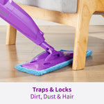 Purple Rejuvenate mop head fitted with a blue microfiber pad cleaning under a wooden chair leg, captioned 'Traps & Locks'.