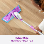 Overhead view of a purple Rejuvenate mop with blue microfiber pad cleaning a wood floor, captioned 'Extra-Wide'.