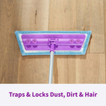 Top-down view of Rejuvenate purple mop head with attached blue microfiber pad on a wood floor.