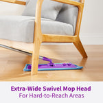 Purple Rejuvenate mop with blue pad reaching under a wooden chair to show extra-wide swivel mop head.