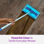 Mop with a blue Rejuvenate microfiber pad cleaning muddy footprints from a dark wood floor, showing before/after motion.