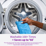 Hand placing a blue Rejuvenate microfiber pad into the drum of a front-load washing machine, showing washability.