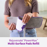 Person attaching a Rejuvenate PowerMax microfiber pad onto a mop head, showing pad backing and textured surface