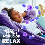 Person reclining on a couch wearing a purple sweater with floating purple flowers and text 'WELCOME TO THE WORLD OF RELAX'
