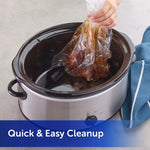 Person lifting a used clear liner out of a clean slow cooker to show easy disposal and quick cleanup