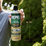 Hand holding a Repel Camp Fogger can upright with dashed measurement line showing 9.75" against a garden background