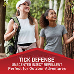 Outdoor lifestyle image of two smiling hikers in a forest with a red banner reading Tick Defense unscented insect repellent