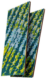 Two stacked corrugated FlyPad sticky traps showing blue, green and yellow patterned ridged surfaces