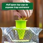 Hand pulling open top cap of a RESCUE! Yellowjacket Trap to expose the trap entrance, close-up view