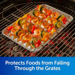 Disposable aluminum grill pan on a charcoal grill with skewered shrimp and vegetables, text reads 'Protects Foods from Falling Through the Grates'
