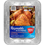 Close-up of a Reynolds Kitchens labeled aluminum roasting pan with roasted chicken photo on label