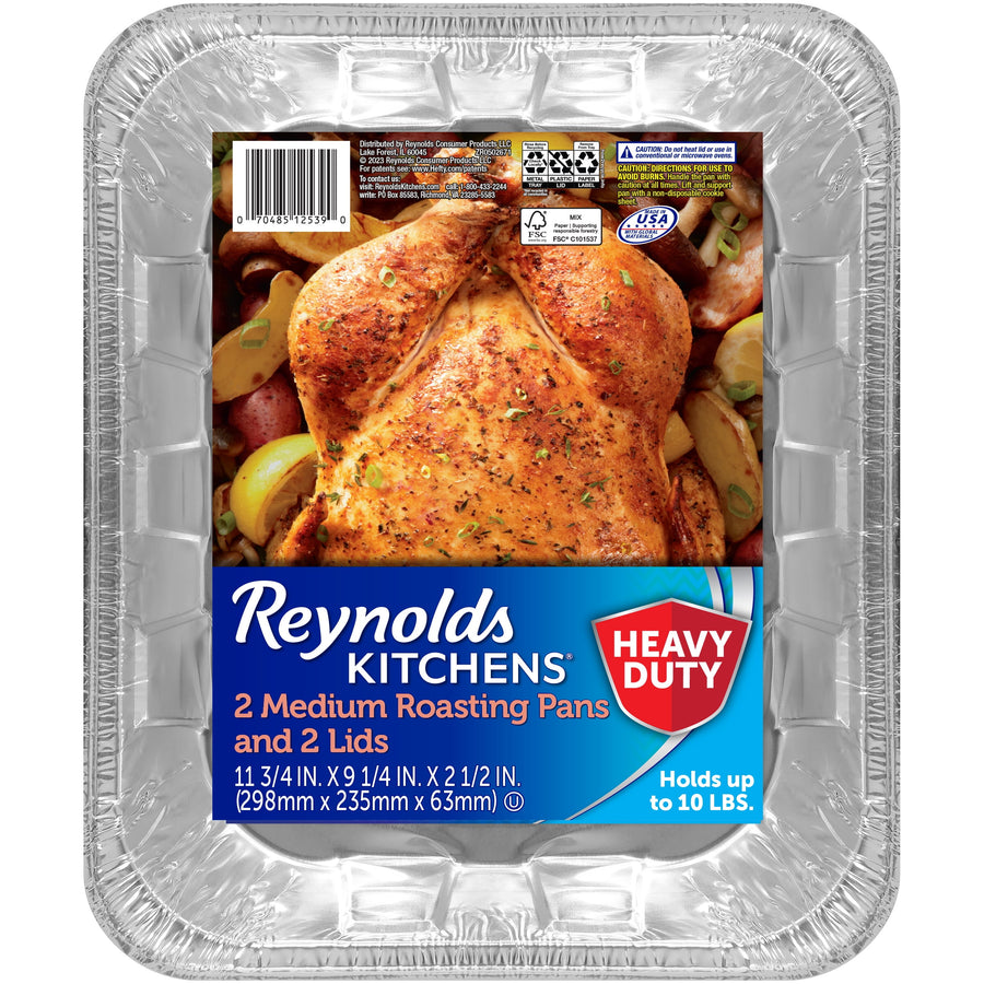 Close-up of a Reynolds Kitchens labeled aluminum roasting pan with roasted chicken photo on label