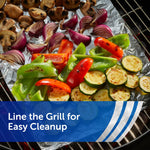 Grill lined with crinkled aluminum foil topped with roasted vegetables to illustrate lining the grill for easy cleanup