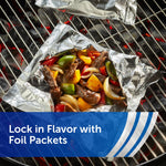 Aluminum foil packet on a grill holding cooked vegetables and meat to demonstrate locking in flavor with foil packets