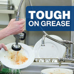 Person rinsing heavily soiled plates under a spray hose in a sink, overlaid with a 'Tough on Grease' banner.