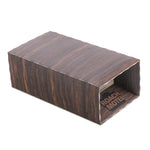 Single Roach Motel cardboard trap shown isolated on a white background with wood-grain print.
