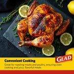 Glazed roasted chicken on a dark slate with lemon slices, styled Glad branding banner at bottom
