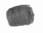 Single rectangular pad of gray steel wool photographed on a white background, showing fibrous metallic texture
