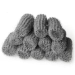Pile of multiple gray steel wool pads arranged in a small stack, showing ribbed and fibrous textures