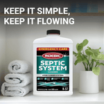 Roebic K-57 septic system cleaner bottle placed on a bathroom shelf next to towels and a potted plant