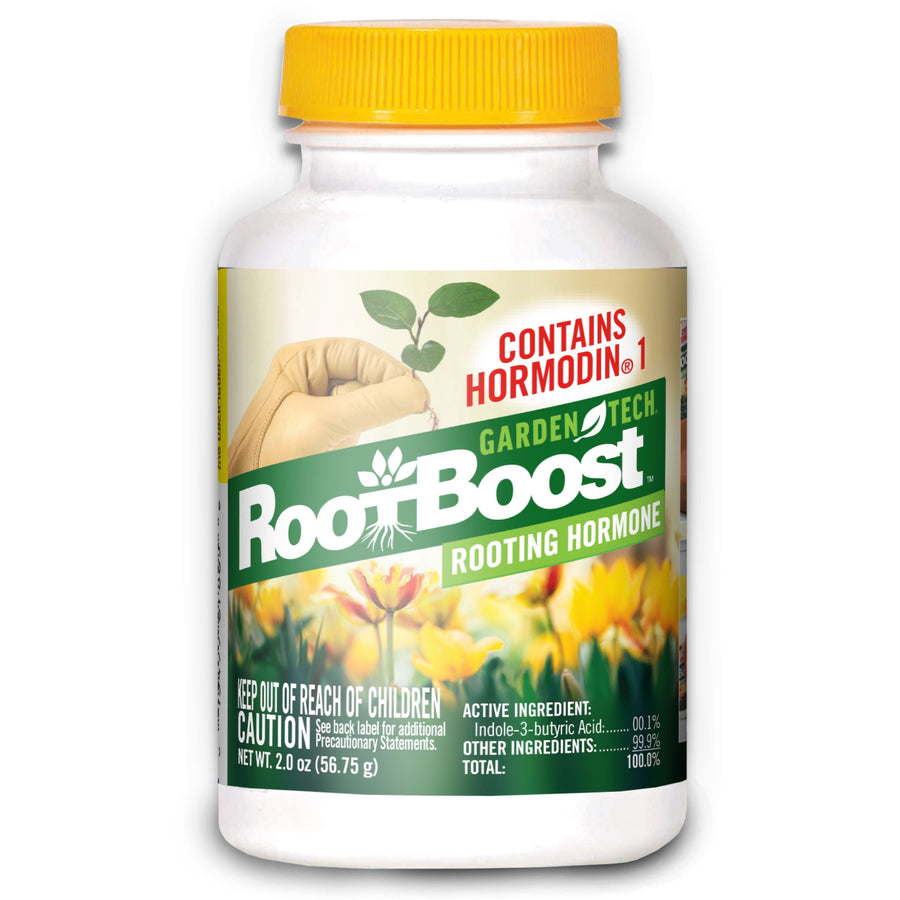 White plastic bottle of RootBoost rooting hormone with yellow cap and floral label